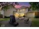 Backyard featuring a patio area with comfortable seating, ideal for outdoor entertaining at dusk at 244 W Admiral S Way, Carmel, IN 46032