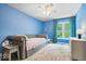 Bedroom featuring accent wall, comfortable seating and lots of natural light at 244 W Admiral S Way, Carmel, IN 46032