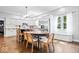 Bright kitchen with white cabinets, hardwood floors, stainless steel appliances, and a breakfast bar at 244 W Admiral S Way, Carmel, IN 46032