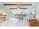 Comfortable living room showcasing exposed wood beams, a plush sectional, and an open floor plan at 244 W Admiral S Way, Carmel, IN 46032