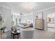 Bright main bedroom boasts sitting area, bay window and view to ensuite bathroom at 244 W Admiral S Way, Carmel, IN 46032