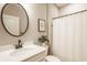Neutral bathroom featuring round mirror and vanity with quartz countertop at 2548 Ruffian Dr, Westfield, IN 46074