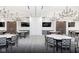 Elegant dining area with modern lighting, tables and chairs for residents at 2548 Ruffian Dr, Westfield, IN 46074