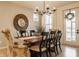 Elegant dining room with a chandelier, wood table, and stylish chairs at 2548 Ruffian Dr, Westfield, IN 46074