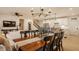 Inviting dining area with a wooden table, elegant chairs, and an open view to the living room and kitchen at 2548 Ruffian Dr, Westfield, IN 46074