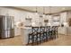 Beautiful kitchen with white cabinets, stainless steel appliances, and a large center island with seating at 2548 Ruffian Dr, Westfield, IN 46074