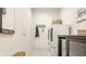 Convenient laundry room equipped with a washer, dryer, and ample storage options at 2548 Ruffian Dr, Westfield, IN 46074