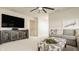 Inviting living room with a cozy gray couch, entertainment center and decor at 2548 Ruffian Dr, Westfield, IN 46074