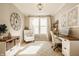 Charming home office featuring wood desk, accent chair, and eye-catching decor at 2548 Ruffian Dr, Westfield, IN 46074