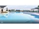 Inviting community pool area with crystal-clear water, lounge chairs and ample space to relax at 2548 Ruffian Dr, Westfield, IN 46074