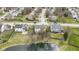 Stunning aerial view of the property showcasing the backyard pond and neighborhood at 300 Wyndotte Dr, Carmel, IN 46032