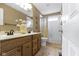 Bathroom with double vanity, granite countertop, tile floor, and shower with bathtub at 300 Wyndotte Dr, Carmel, IN 46032