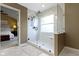 Glass enclosed shower features a built-in seat and handheld shower wand at 300 Wyndotte Dr, Carmel, IN 46032