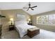 Inviting bedroom boasts large windows, vaulted ceilings, and a ceiling fan for added comfort at 300 Wyndotte Dr, Carmel, IN 46032