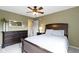 Cozy bedroom with ceiling fan, dresser, and neutral wall color at 300 Wyndotte Dr, Carmel, IN 46032