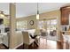 Inviting dining area with access to outdoor patio, featuring hardwood floors at 300 Wyndotte Dr, Carmel, IN 46032