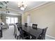Spacious dining room with a large table, blending traditional and modern elements at 300 Wyndotte Dr, Carmel, IN 46032