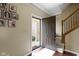 Inviting entryway with wood floors, staircase, and photos creating a warm, personal touch at 300 Wyndotte Dr, Carmel, IN 46032