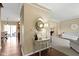 Elegant foyer with hardwood floors, a decorative table, and a glimpse into the living spaces at 300 Wyndotte Dr, Carmel, IN 46032