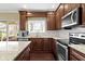 Well-appointed kitchen featuring stainless steel appliances, granite countertops, and ample cabinetry at 300 Wyndotte Dr, Carmel, IN 46032