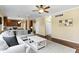 Spacious open-concept living area leading to a kitchen, offering hardwood floors and plenty of natural light at 300 Wyndotte Dr, Carmel, IN 46032