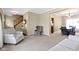 Open-concept living room with a staircase and seamless flow into the dining area at 300 Wyndotte Dr, Carmel, IN 46032