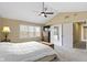 Spacious main bedroom with vaulted ceiling, ceiling fan, and large windows providing ample natural light at 300 Wyndotte Dr, Carmel, IN 46032