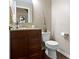 Powder room with granite countertop, stylish vanity, and modern fixtures at 300 Wyndotte Dr, Carmel, IN 46032