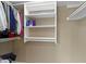 Walk-in closet featuring neutral walls and built-in shelving for optimal storage at 300 Wyndotte Dr, Carmel, IN 46032