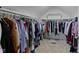 Spacious walk-in closet offers ample storage space with clothing racks and shelving at 300 Wyndotte Dr, Carmel, IN 46032