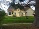 A spacious backyard with a grassy lawn and inviting deck area for entertaining at 3237 Boxwood Dr, Indianapolis, IN 46227