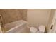 This bathroom features a bathtub with neutral walls and tile floors at 3237 Boxwood Dr, Indianapolis, IN 46227