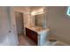 Spacious bathroom with dual sinks, a soaking tub, and bright lighting at 3237 Boxwood Dr, Indianapolis, IN 46227