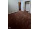 This bedroom includes plush carpeting and white bi-fold closet doors at 3237 Boxwood Dr, Indianapolis, IN 46227