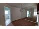 Bright dining room featuring a chandelier and mirrored wall at 3237 Boxwood Dr, Indianapolis, IN 46227