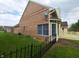 Exterior of house shows brickwork, windows, and a small patch of garden at 3237 Boxwood Dr, Indianapolis, IN 46227