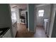 Kitchen area with view to laundry room, white appliances and tile flooring at 3237 Boxwood Dr, Indianapolis, IN 46227