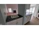 A kitchen sink and breakfast bar that opens into a living space at 3237 Boxwood Dr, Indianapolis, IN 46227