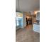 Bright kitchen features stainless steel appliances, tile flooring, and modern lighting fixture at 3237 Boxwood Dr, Indianapolis, IN 46227