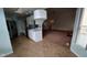 Bright kitchen features stainless steel appliances and tile flooring, connecting to the open concept living room at 3237 Boxwood Dr, Indianapolis, IN 46227