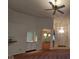 Open-concept living room with high ceilings, a fireplace, and an adjacent wet bar at 3237 Boxwood Dr, Indianapolis, IN 46227