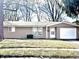 Cozy single-story home featuring a one-car garage, light brown siding and a well-maintained front yard at 3642 Horth Ct, Indianapolis, IN 46235