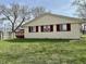 Exterior of home with a red deck and green lawn at 3841 Monica Ct, Indianapolis, IN 46226