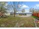 View of the backyard featuring a playset, garage, and patio with hammock and chairs at 415 Elm Ave, Sheridan, IN 46069