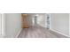 Spacious basement with light gray walls and flooring, equipped with a climbing gym, leading to multiple rooms at 415 Elm Ave, Sheridan, IN 46069
