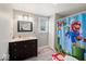 Bright bathroom with a single sink vanity, stylish fixtures, and whimsical Super Mario themed shower curtain at 415 Elm Ave, Sheridan, IN 46069