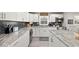 Stylish kitchen with stainless steel appliances, granite counters, dark backsplash, and ample cabinet space at 415 Elm Ave, Sheridan, IN 46069