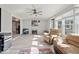 Bright living room with vinyl flooring, offering versatile space for both relaxation and play, with ample natural light at 415 Elm Ave, Sheridan, IN 46069