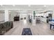 Spacious open-concept living area with modern flooring seamlessly connects the living, dining, and kitchen spaces at 415 Elm Ave, Sheridan, IN 46069
