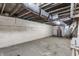 Unfinished basement with exposed ceiling and concrete floor, utilities visible at 420 Orange St, Indianapolis, IN 46225